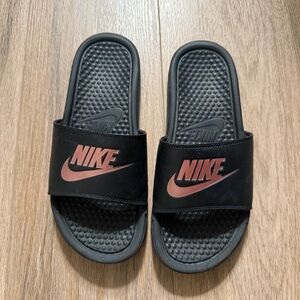 Nike Women's slide sandals in black and rose gold